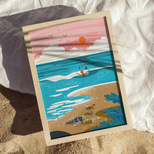 Framed artwork of a beach scene with a sunset and a group of sea swimmers