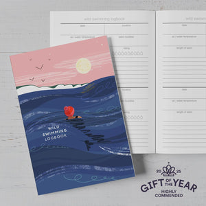 The wild swimming logbook with the inside pages with prompts to log your cold water dips and swims with the Gift of the Year logo