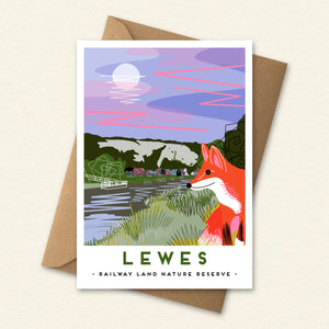 A fox at the railway land in Lewes by the river Ouse with a full moon rising over the cliffs.