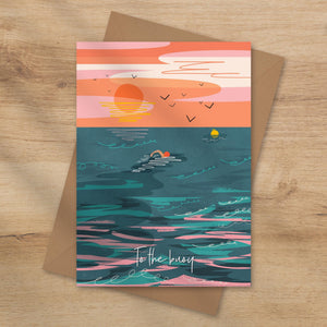 Greeting card with a colourful design of a sunset, ocean, and a wiild swimmer swimming to the buoy