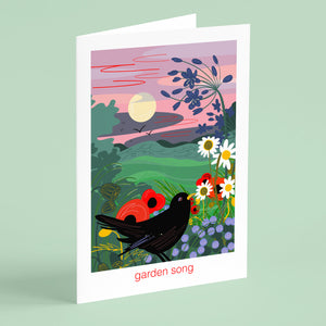 Greeting card with a colorful illustration of birds and flowers on a green background