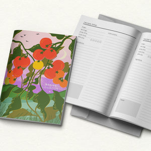 Recipe logbook with tomato-themed cover and open pages on a white background