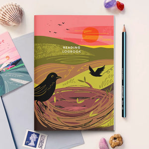 Reading logbook with the Nest cover and with stationery and decorative items around it