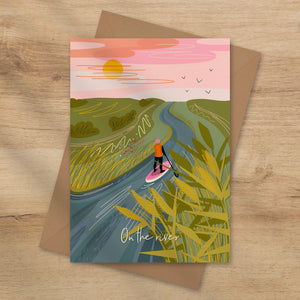 Greeting card with a paddleboarder on a river scene and 'On the river' text.
