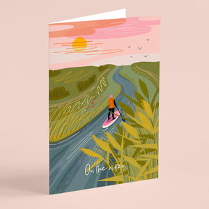 Greeting card with a paddleboarder on a river scene and 'On the river' text.