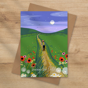 Greeting card with a illustration of a person walking through a field with flowers and a blue sky.