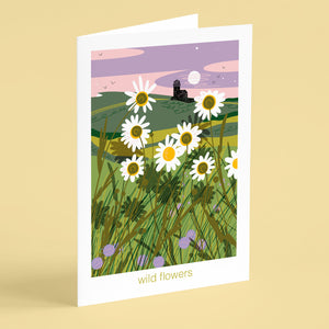 Greeting card with illustration of a field of wildflowers and a lighthouse nature greeting card coastal illustration by onneke