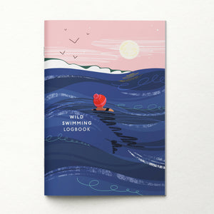 Notebook titled 'Wild Swimming Logbook' with a design of a person swimming in the ocean under a pink sky.